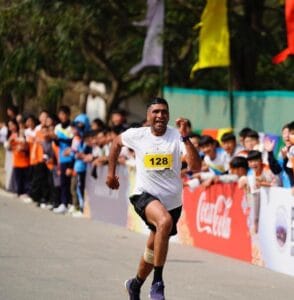 Excited runner running to the finishing line